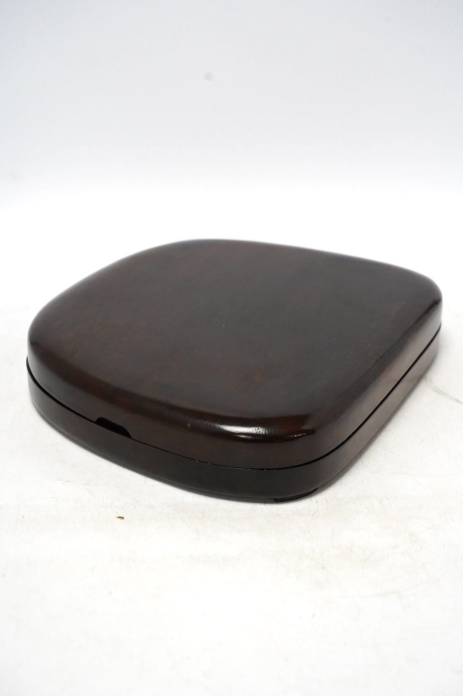 A hardwood cased Japanese ink stone, 20.5 x 24cm. Condition - good